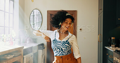 Buy stock photo Energy, woman and dancing with headphones in kitchen for weekend break, radio playlist or feel good subscription. Dancer, african person or happy with album track, listening to audio or sound in home