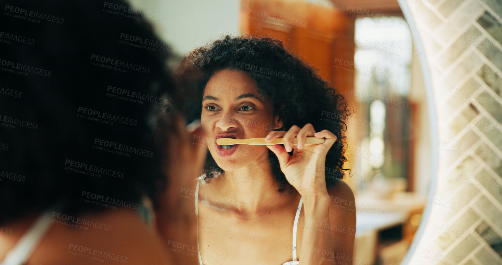 Buy stock photo Mirror, oral hygiene and woman with brushing teeth in bathroom for morning routine, self care and getting ready. Dental health, reflection and cleaning mouth with toothbrush for fresh breath in home