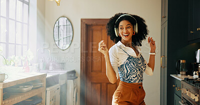 Buy stock photo Headphones, woman and dancing to music in kitchen for audio playlist, freedom and streaming album. Happy, african person and fun with radio track, feel good song or media podcast with energy in home