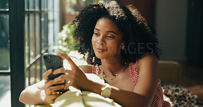 Buy stock photo Happy, phone and African woman on sofa in home for social media, networking and communication. Apartment, living room and person on smartphone for online chatting, internet post or website on weekend