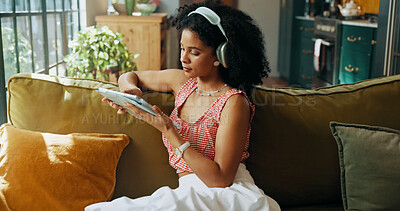 Buy stock photo Headphones, tablet and woman in apartment with music video, streaming sound and subscription. Living room, audio technology and African person listening to song, radio and audiobook online to relax