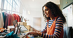 Fashion, woman and typing on laptop at small business for inventory management, supply chain and dropshipping. Ecommerce, startup owner and tech for shipping info, delivery tracking or garment order