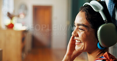 Buy stock photo Podcast, headphones and girl laughing in house living room for streaming radio or comedy. Relax, zen and happy woman with smile in lounge listening to funny audio, joke or sound in home for humor