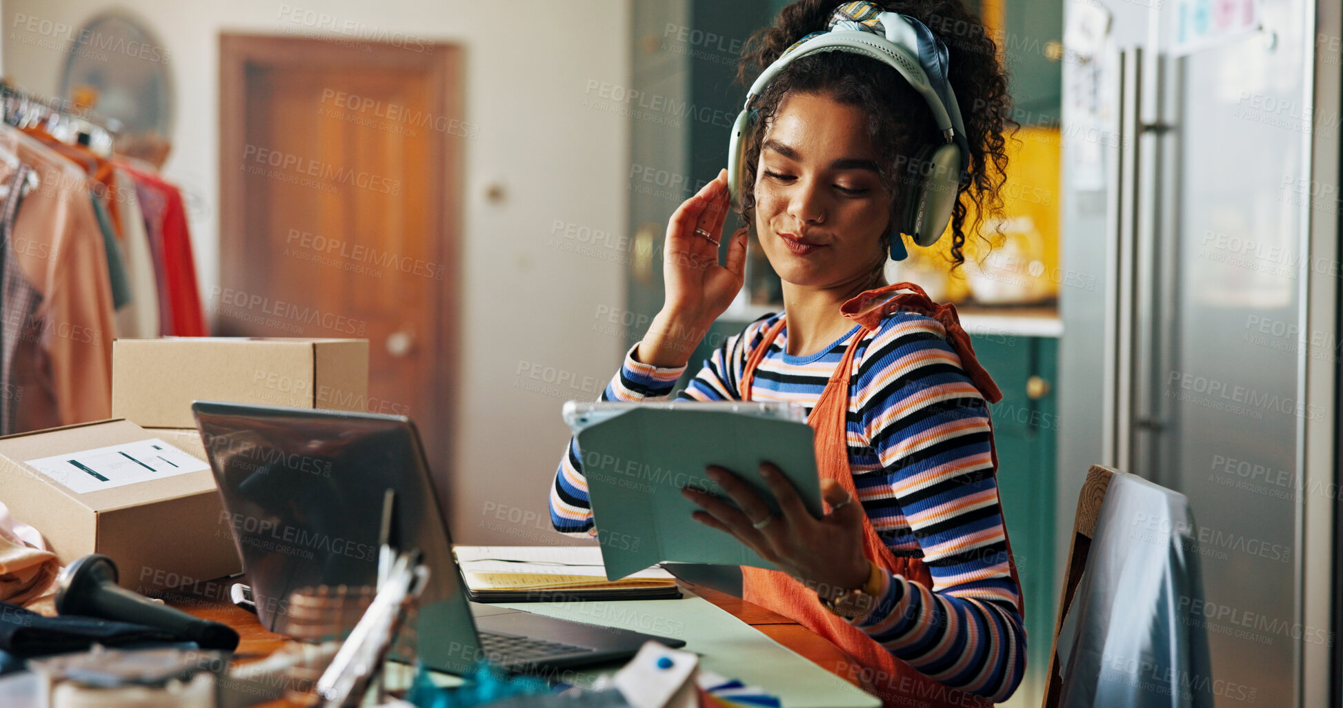 Buy stock photo Fashion designer, tablet and woman in home with headphones for music, podcast and radio. Small business, creative and person on computer for ecommerce, textile order and clothing retailer startup