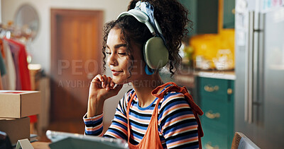 Buy stock photo Creative, headphones and woman on tablet in home for logistics, planning and stylist for small business. Fashion designer, startup and person listen to music for tailor, textile and clothing retailer