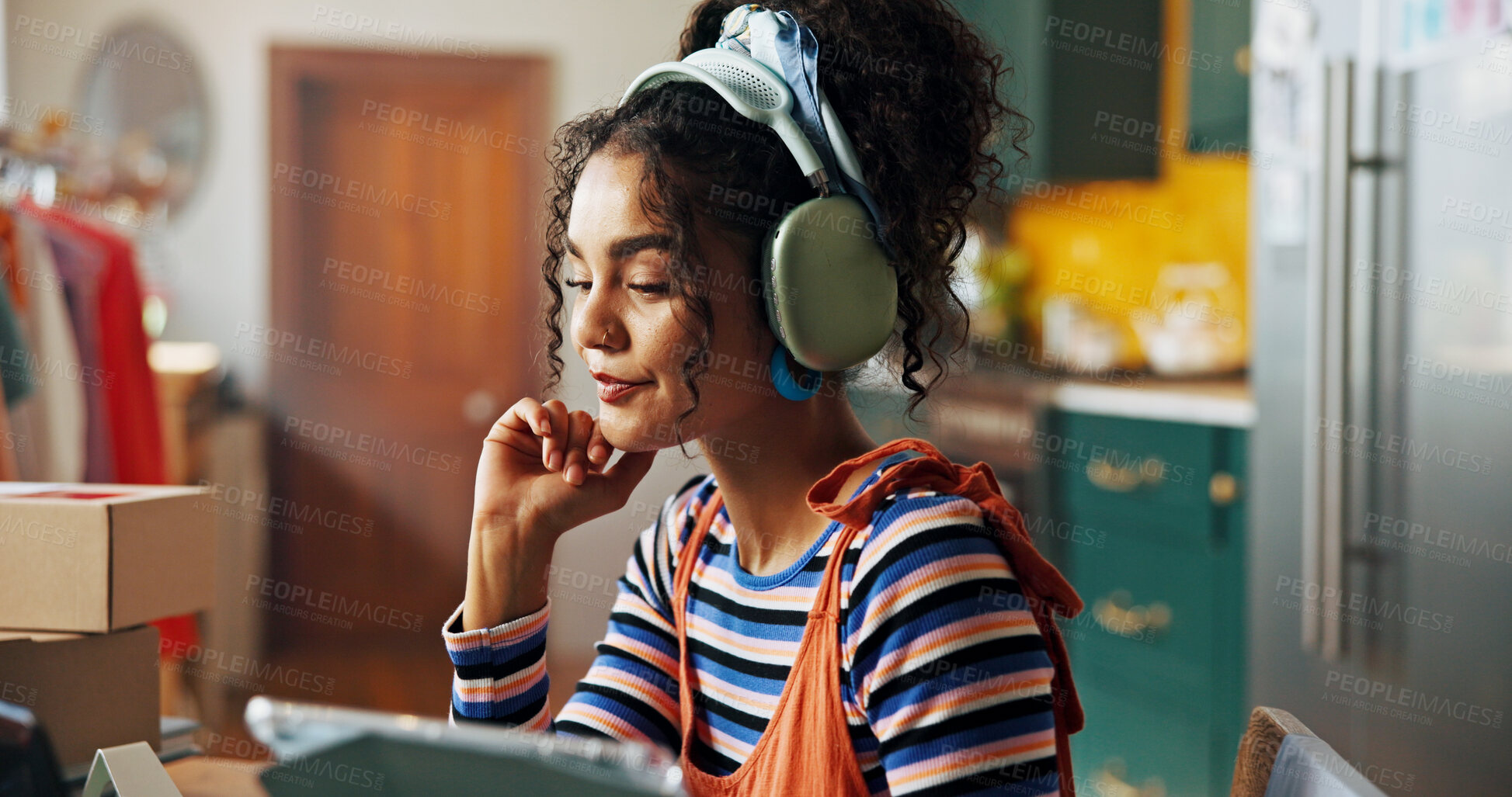 Buy stock photo Creative, headphones and woman on tablet in home for logistics, planning and stylist for small business. Fashion designer, startup and person listen to music for tailor, textile and clothing retailer