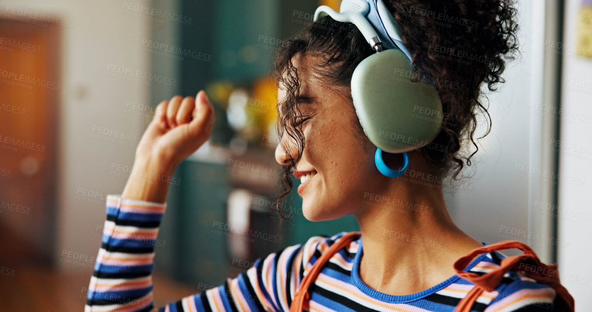 Buy stock photo Woman, headphones and happy with dancing in home, kitchen and listen to music with streaming. Girl, person and smile with audio, subscription and excited with rhythm, sound and profile at apartment