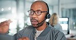 Call center, communication and black man with headset in office for contact us with crm. Talking, customer experience and African male technical support agent with audio tech for lead generation.