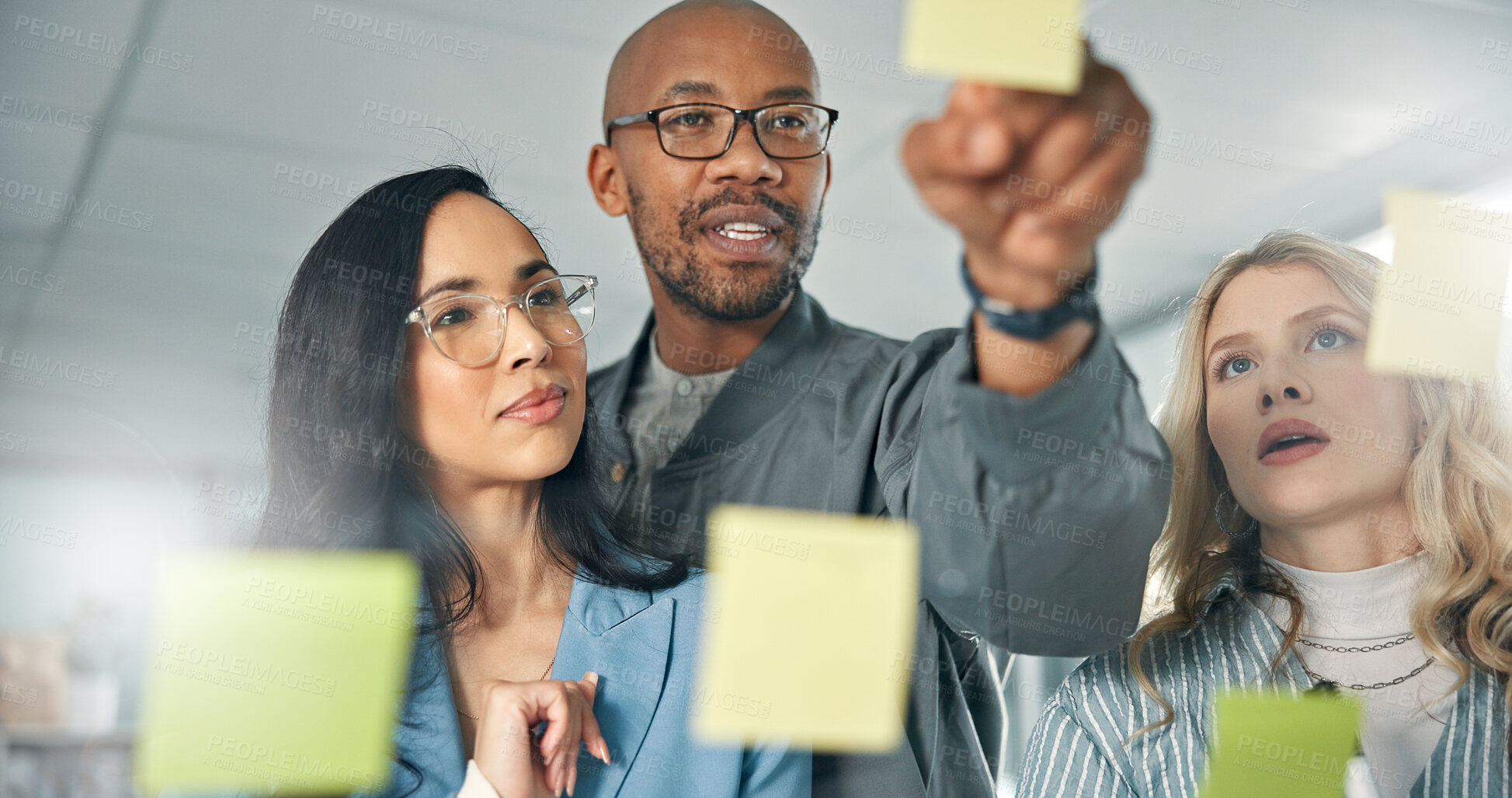 Buy stock photo Team, glass board and business people planning on sticky notes for project ideas, schedule and agenda. Collaboration, problem solving and colleagues in discussion for brainstorming meeting in office