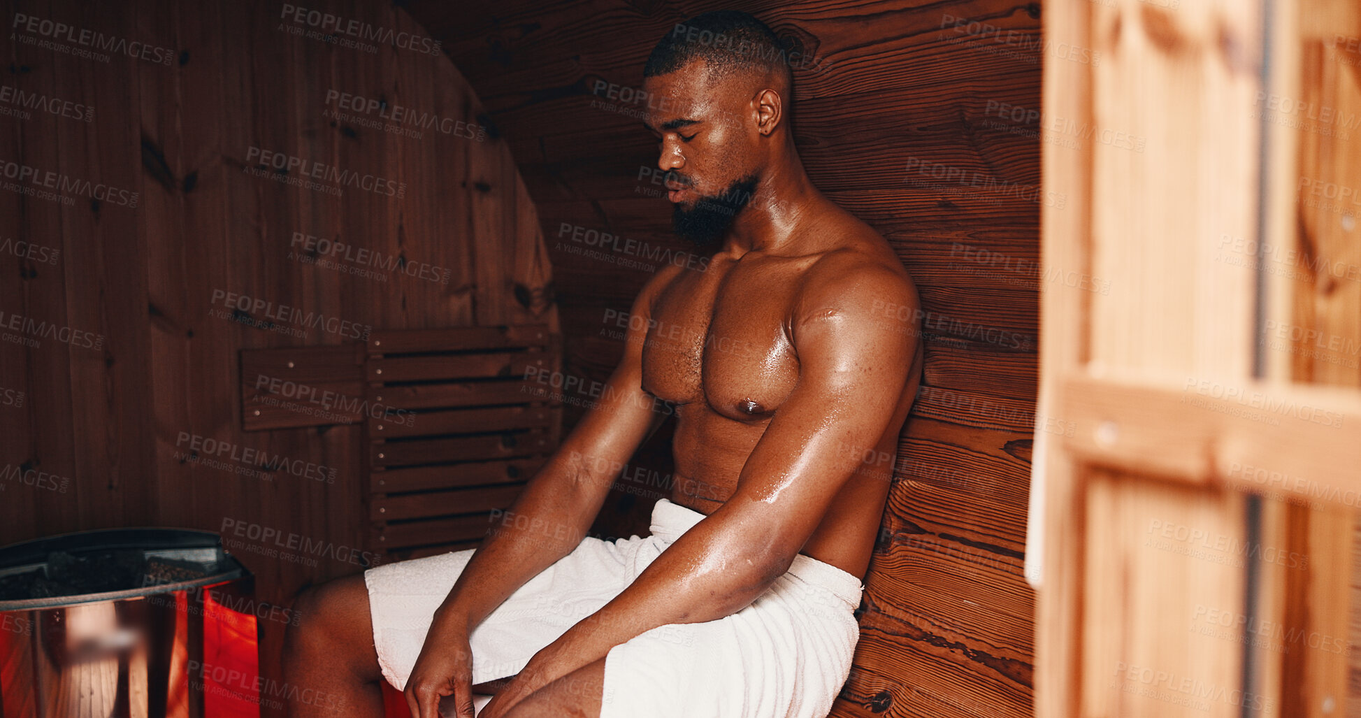 Buy stock photo Sauna, fitness and relax with black man in gym for muscle recovery, post workout and health. Detox therapy, athlete cramp prevention and wellness with person in steam room for sweating and spa