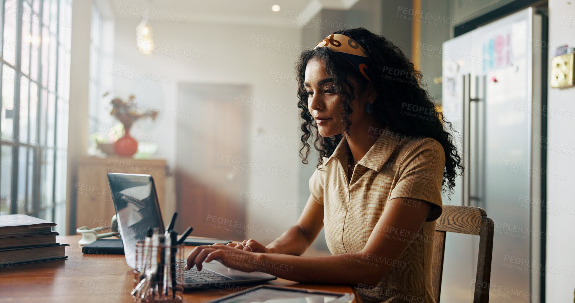 Buy stock photo Girl, student and laptop with typing in home for online course, e learning and development in morning. Woman, person and editing project with pc for education, scholarship and class on web in kitchen
