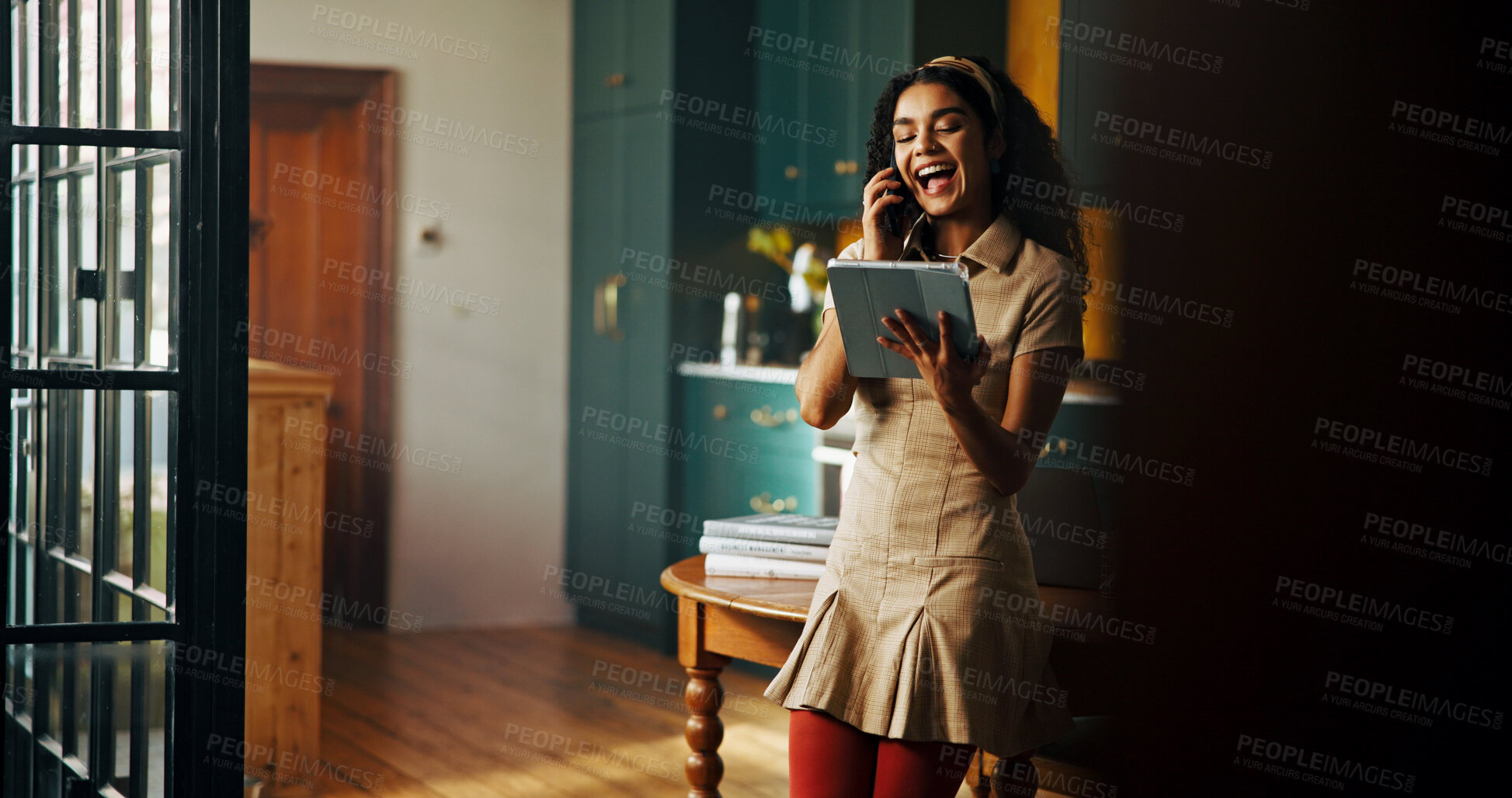 Buy stock photo Phone call, remote work and tablet with woman laughing in kitchen of home for small business planning or research. App, conversation and funny with freelancer in apartment for startup development
