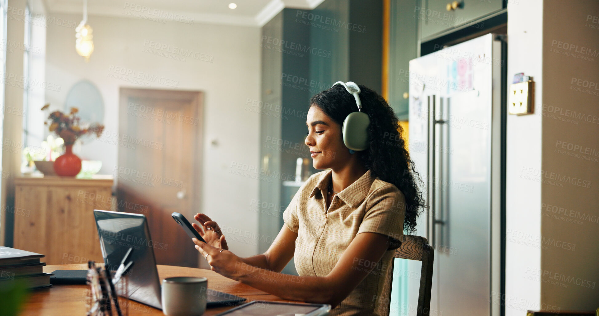 Buy stock photo Girl, student and phone with headphones in kitchen for online course, e learning or texting on mobile app. Woman, smartphone and social media on break for education, scholarship or research at house