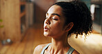 Breathing, meditation and yoga with woman in kitchen of home for balance, health or holistic routine. Chakra, fitness and stress relief with yogi person on floor in apartment for mindfulness