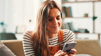 Buy stock photo Phone, relax and woman on sofa in home with networking, communication or contact on mobile app. Happy, cellphone and female person texting on social media for online conversation in living room.
