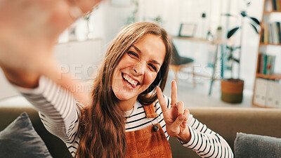 Buy stock photo Peace sign, selfie and portrait of woman in home for relax, calm and break on weekend for social media. Happy, tongue out and person with photography for profile picture in living room at house.