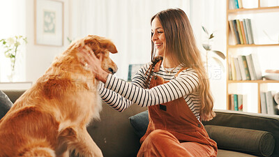Buy stock photo Care, training or happy woman in home with dog, support or companion on sofa with fun or love. Animal adoption, obedience or person in apartment with golden retriever, best friend or pet for bonding