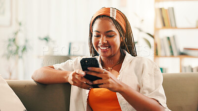 Buy stock photo Smile, relax and woman with smartphone in home for social media, reading forum or ebook. African person, mobile and online on sofa with chat app for communication, text notification or download game