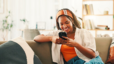Buy stock photo Smile, internet and woman with mobile on sofa for social media, reading forum and ebook. African person, phone and relax in home with chat app for communication, text notification and download game