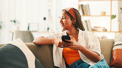 Buy stock photo Smile, thinking and woman with mobile on sofa for social media, inspiration or idea for online blog. African person, phone and thoughts in home with chat app for communication, vision and reflection