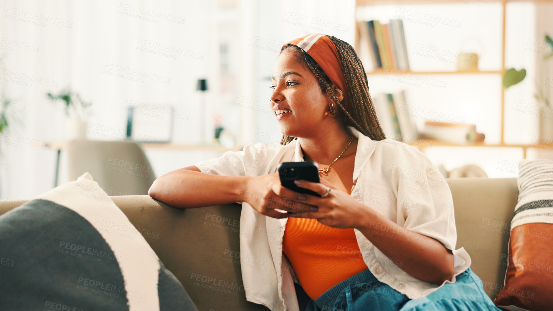Buy stock photo Smile, thinking and woman with mobile on sofa for social media, inspiration or idea for online blog. African person, phone and thoughts in home with chat app for communication, vision and reflection