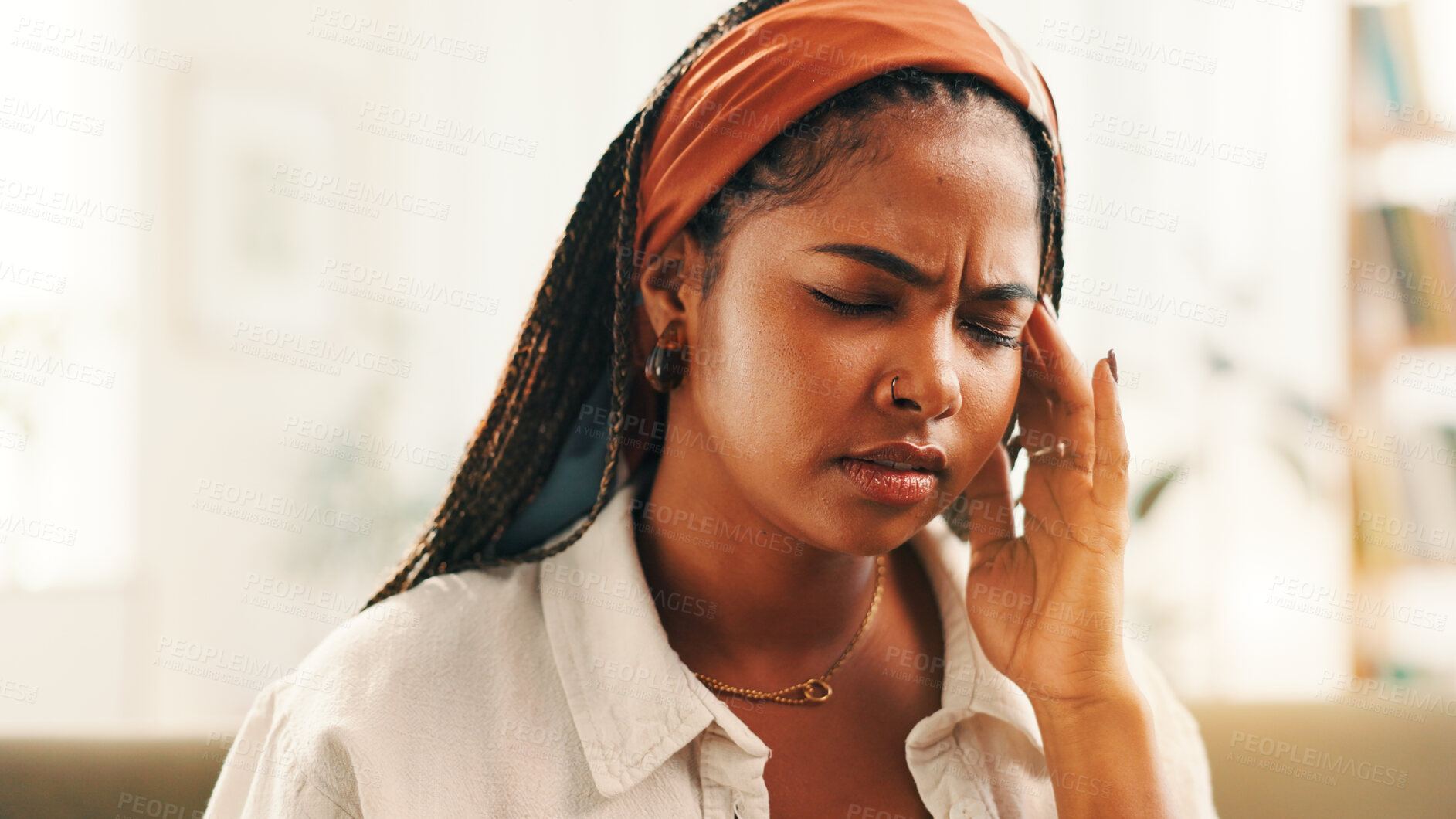 Buy stock photo Anxiety, headache and stress with black woman on sofa in living room of home for break or recovery. Burnout, migraine or tension and person in apartment with symptoms of discomfort, fatigue or pain