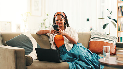 Buy stock photo Relax, laptop and happy woman with phone in home for social media, reading forum or blog. Sofa, smile and African person on tech with chat app for communication, online notification or download game