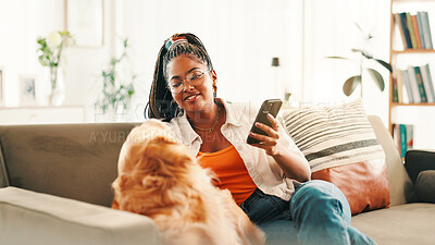 Buy stock photo Phone, relax and black woman on sofa with dog for bonding, reading or social media scroll at home on day off. Smartphone, smile and female person in living room with golden retriever, love and search