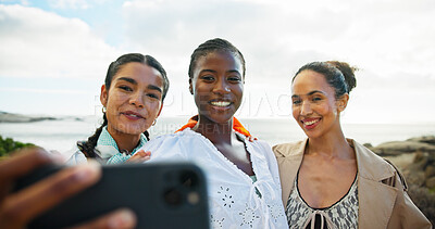 Buy stock photo Women, friends and selfie with smile, beach and memory with diversity, vacation and post on web. People, happy and photography for profile picture, reunion and social network with group by ocean