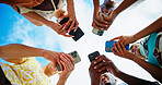 Below, outdoor and people with smartphone, hands or circle with nature, connection or social media. Low angle, group or friends with blue sky, cellphone or tech with network, message or communication
