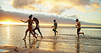 Sunset, running and friends at beach by water for holiday, vacation and summer trip on tropical island. Group, ocean and people race at sea with energy for freedom, travel and excited for adventure