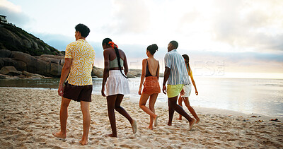Buy stock photo Back view, holiday and friends walking on beach for vacation or summer trip on tropical island together at sunset. Group, tourism and people at ocean for relax, bonding and travel on adventure at sea