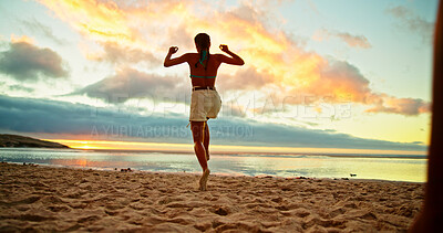 Buy stock photo Back, woman and jump for fun on beach for travel celebration, energy and sunset of summer holiday. Person, playful and achievement of vacation trip, tropical island and freedom of getaway opportunity