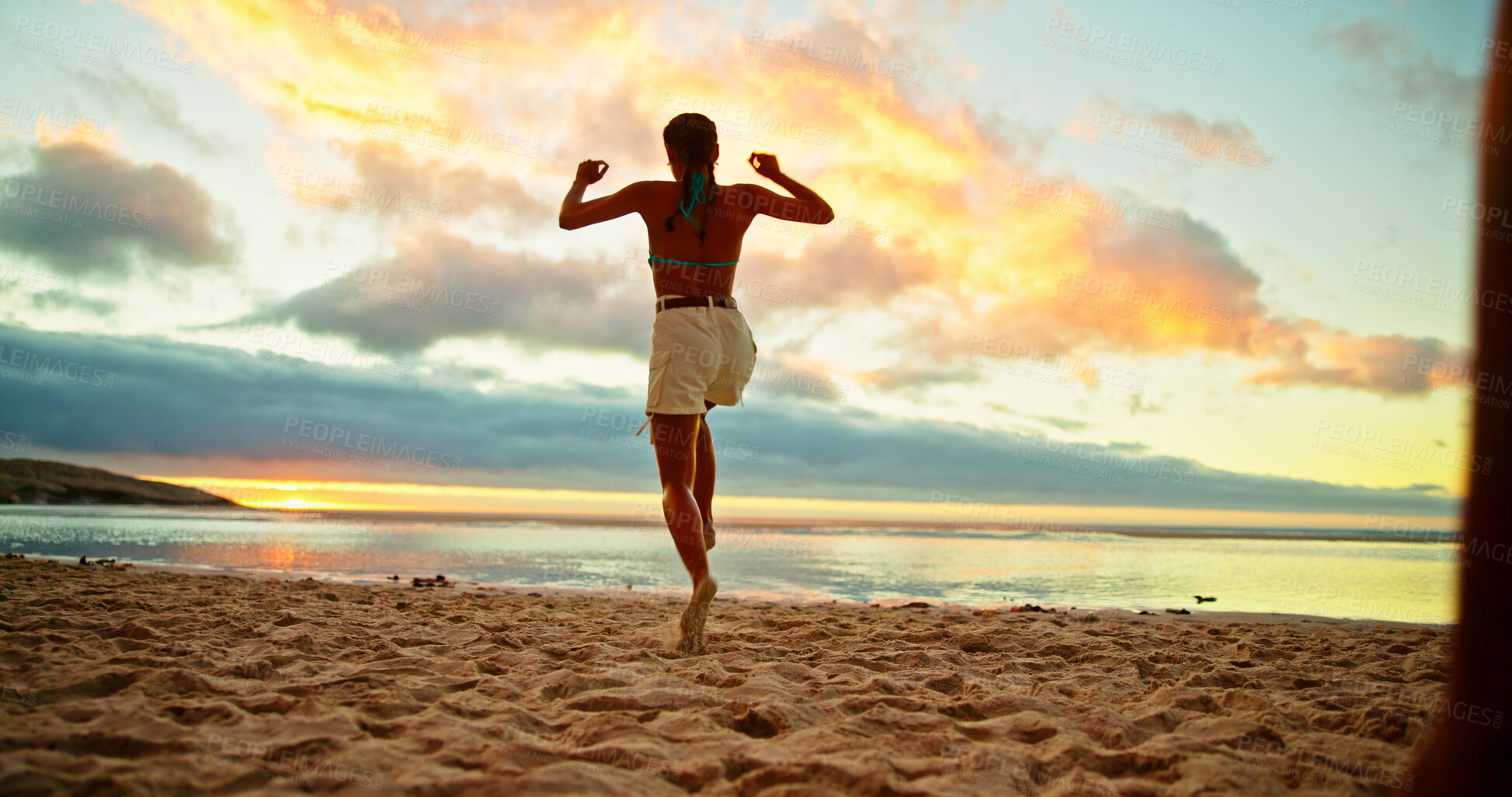 Buy stock photo Back, woman and jump for fun on beach for travel celebration, energy and sunset of summer holiday. Person, playful and achievement of vacation trip, tropical island and freedom of getaway opportunity