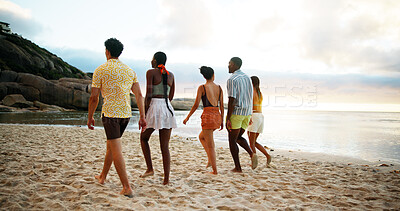Buy stock photo Back view, vacation and friends walking on beach for holiday or summer trip on tropical island together at sunset. Group, tourism and people at ocean for relax, bonding and travel on adventure at sea