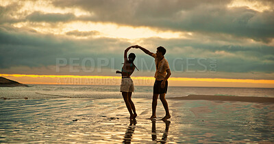 Buy stock photo Couple, dance and holding hands with spin on beach of travel date, romance and sunset of summer holiday. People, play and bonding on vacation trip, tropical island and partner commitment for getaway 