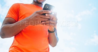 Buy stock photo Hands, phone and sky with sports man outdoor for exercise, fitness or training from below. App, performance and tracking with athlete or runner on break from cardio workout for challenge or update