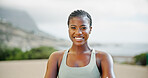 Portrait, outdoor and black woman with smile, exercise and challenge with wellness, progress and confidence. African person, face and runner in street, training for marathon and practice with pride