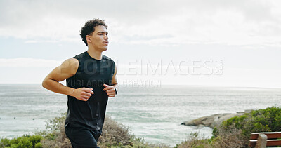 Buy stock photo Seaside, running and man with fitness, training and sports with cardio, workout and challenge. View, person and runner with exercise, outdoor and energy with wellness, practice and healthy with ocean