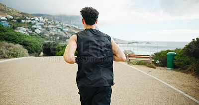 Buy stock photo Back, running and man in street, fitness and training with cardio, workout and challenge. View, person and runner with exercise, outdoor and energy with wellness, practice and healthy with sports