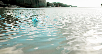 Buy stock photo Plastic bottle, ocean and dirt with pollution for recycling, climate change or global warming in nature. Empty, sea or garbage with rubbish, litter or trash in water for waste, mess or contamination