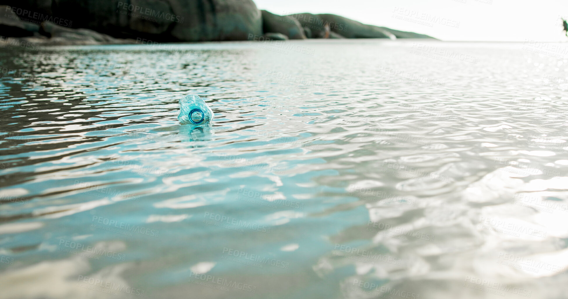 Buy stock photo Plastic bottle, ocean and dirt with pollution for recycling, climate change or global warming in nature. Empty, sea or garbage with rubbish, litter or trash in water for waste, mess or contamination