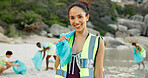 Conservation, portrait and recycling with woman on beach for charity or community service. Cleaning, earth day and smile of happy volunteer on coast for activism, responsibility or sustainability