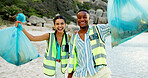 Happy people, portrait and volunteer with dirt on beach for community service or cleaning in nature. Man, woman or social workers with smile, bag or rubbish for recycling or climate change by ocean