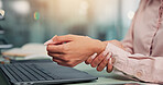 Business woman, laptop and hands with wrist pain at desk for medical injury, deadline pressure or overworked. Professional, analyst and finance report with inflammation, carpal tunnel or nerve sprain
