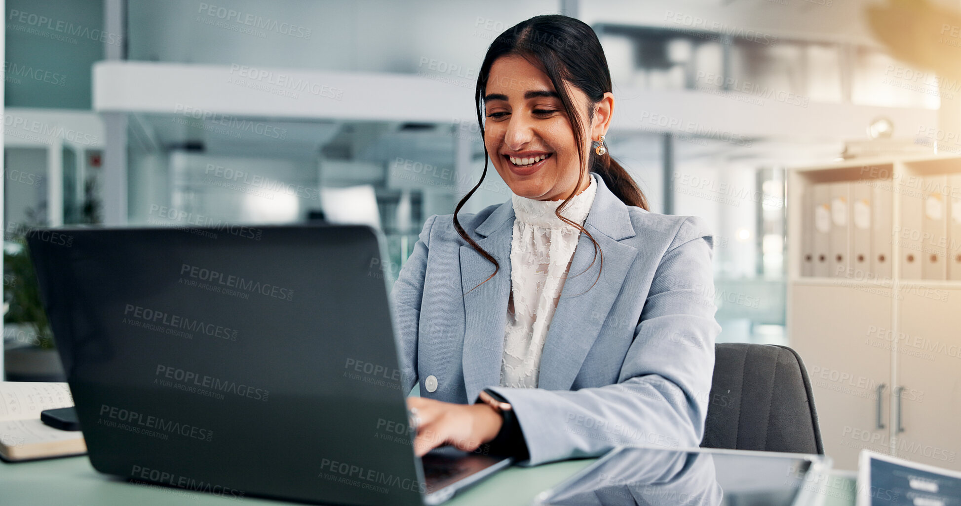 Buy stock photo Happy woman, laptop and typing in office for business, company report and financial review. Accountant, computer and editing in firm for email draft, loan application and pleased with agency survey
