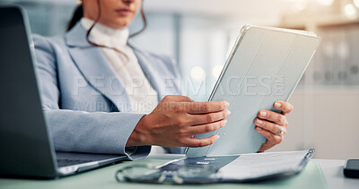 Buy stock photo Business, woman and hands with tablet in office for reading financial report, revenue proposal and account review. Professional, accountant and laptop at desk for investment planning and compliance