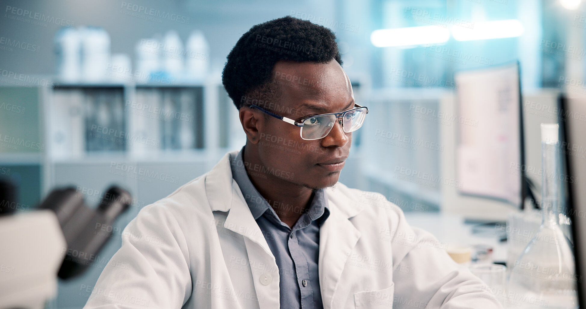 Buy stock photo Computer, reading and man in laboratory for research, development or science ideas. Online analytics, vaccine and African scientist on website for medical study, innovation and biotech engineering