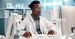 Computer, black man and scientist typing in lab for medical research, discovery or innovation, Tech, science and African male biologist with pharmaceutical report for futuristic genetic development.