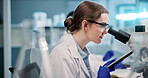 Microscope, woman and scientist in laboratory for medical research, discovery or project on organisms. Biotechnology, goggles and female biologist with equipment for DNA review for innovation,